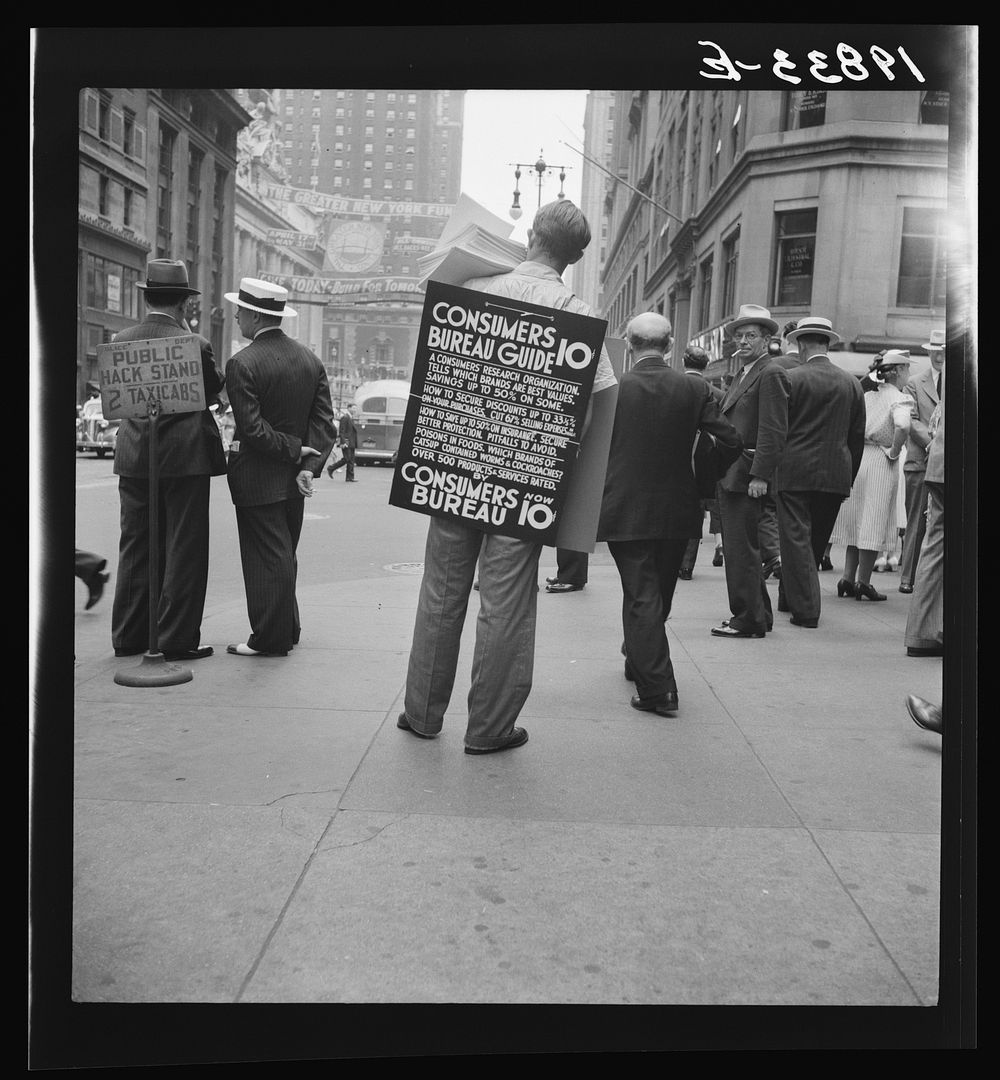 [Untitled photo, possibly related to: 42nd Street and Madison Avenue. Street hawker selling Consumer's Bureau Guide. New…