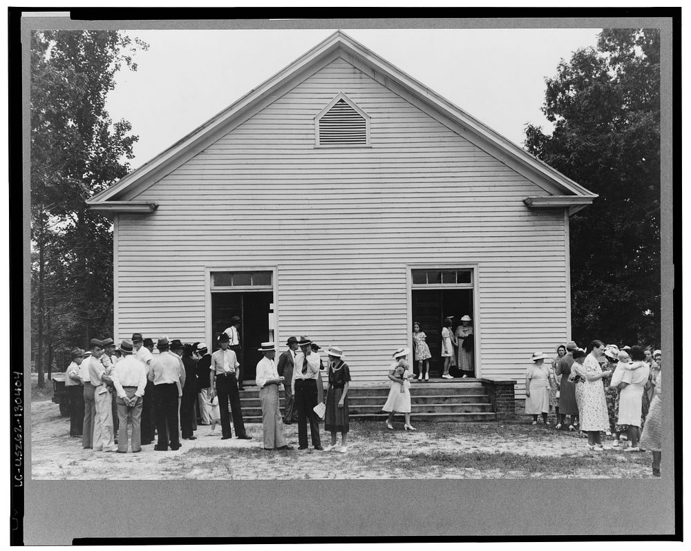Congregation gathers after services to talk. Wheeley's Church, Person County, North Carolina. Sourced from the Library of…