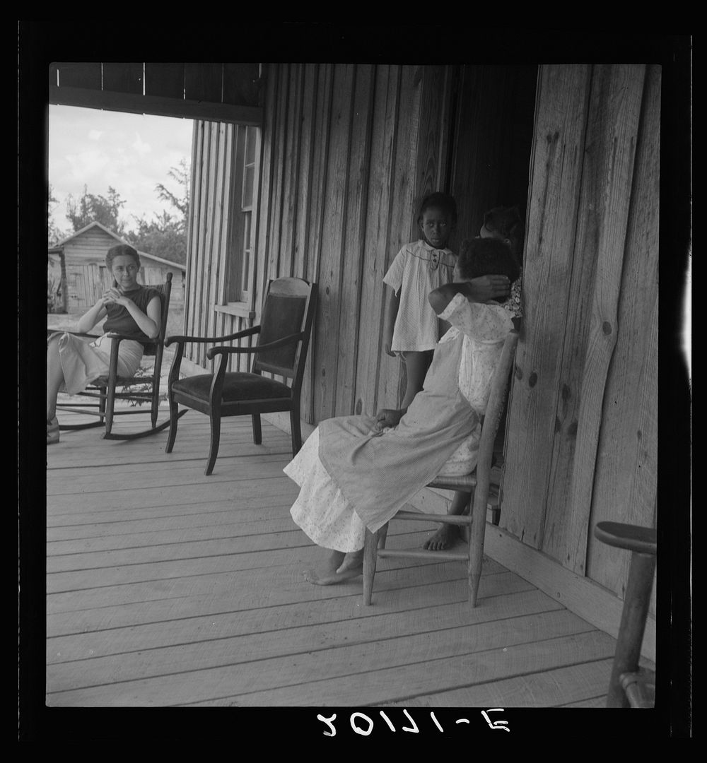[Untitled photo, possibly related to: Wife of tenant farmer with two of her six children, none of whom go to school. Chatham…