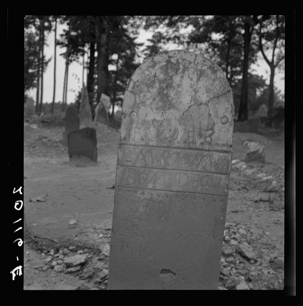 Tombstone in a red clay  cemetery. Person County, North Carolina. Sourced from the Library of Congress.