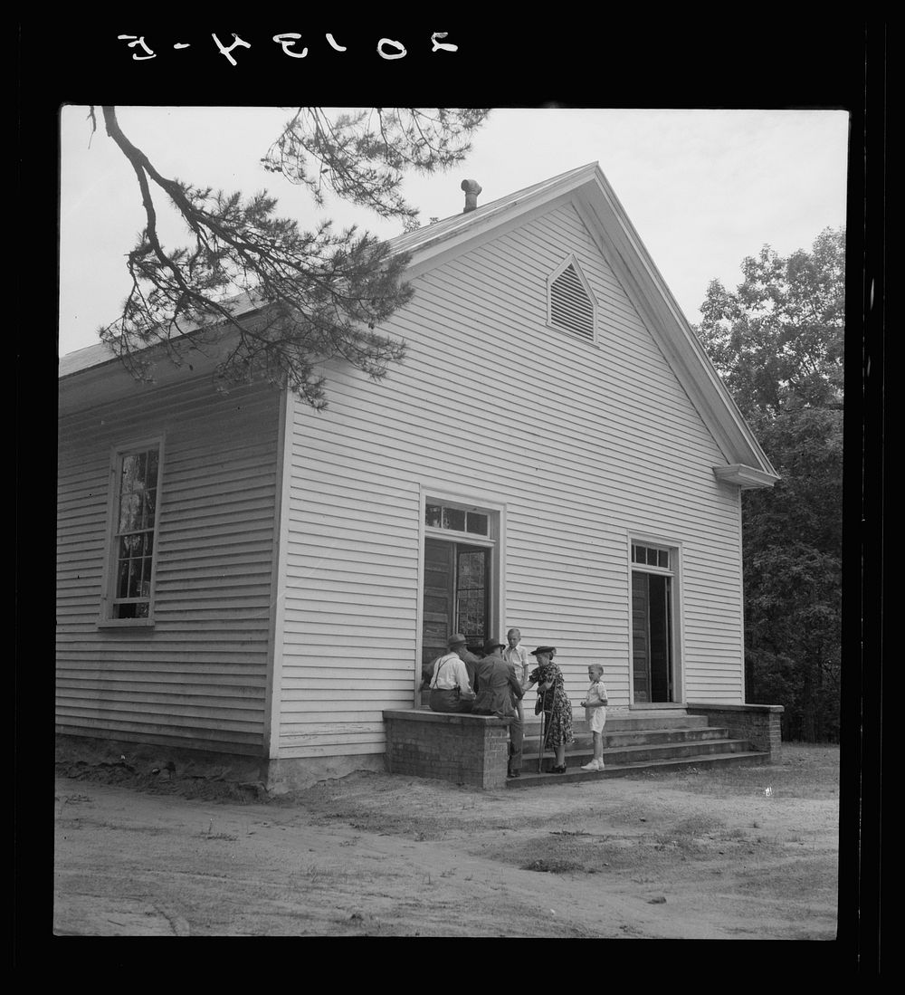 Conversation among members of congregation after services. Wheeley's Church, Gordonton, North Carolina. Sourced from the…