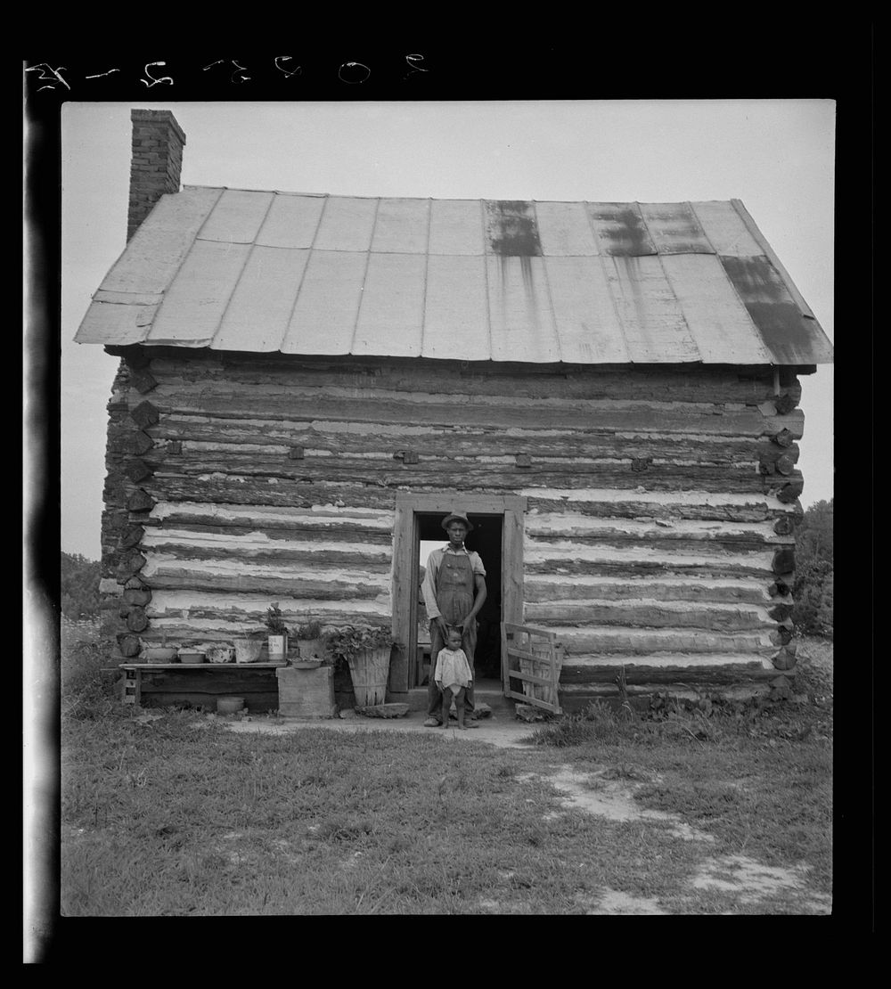 [Untitled photo, possibly related to: Young sharecropper and his first child. Hillside Farm. Person County, North Carolina].…