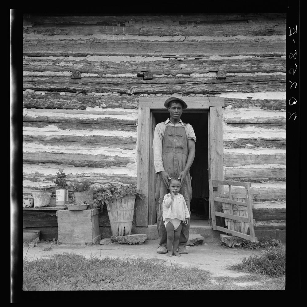 Young sharecropper and his first child. Hillside Farm. Person County, North Carolina by Dorothea Lange