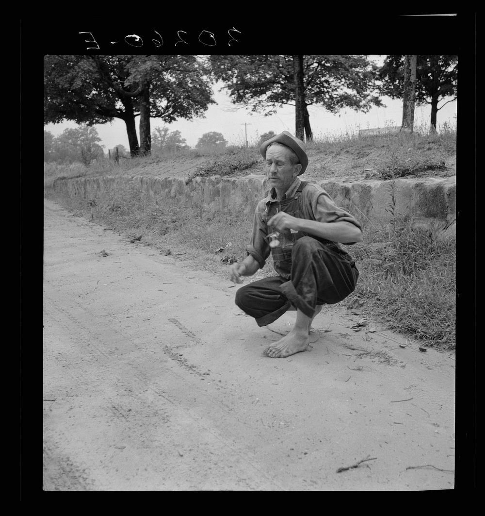 [Untitled photo, possibly related to: Roadside meeting with Durham County farmer. North Carolina. He gives road directions…