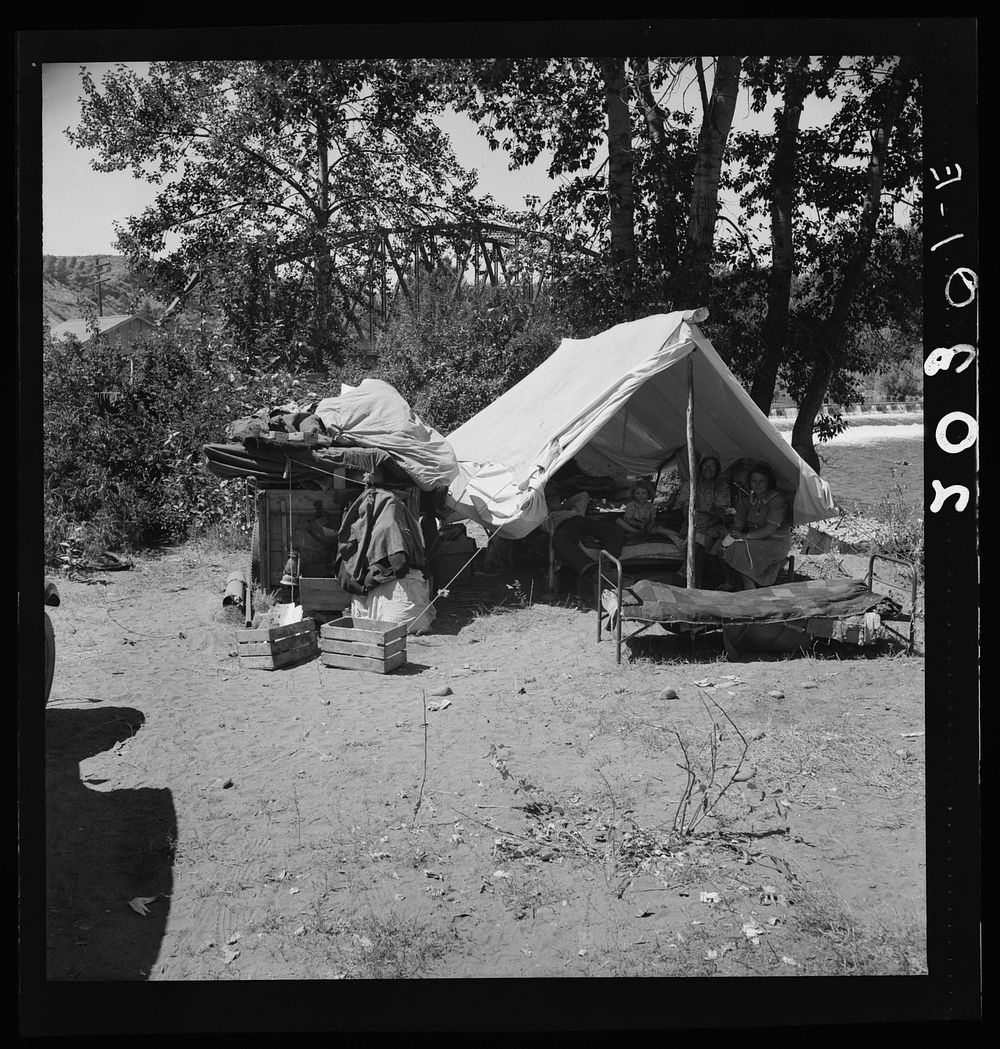 Camp of migratory family originally from Texas in "Ramblers Park." Yakima Valley, Washington. Sourced from the Library of…