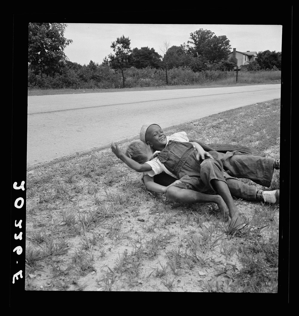 [Untitled photo, possibly related to: White and  boy wrestling by side of road. Person County, North Carolina] by Dorothea…