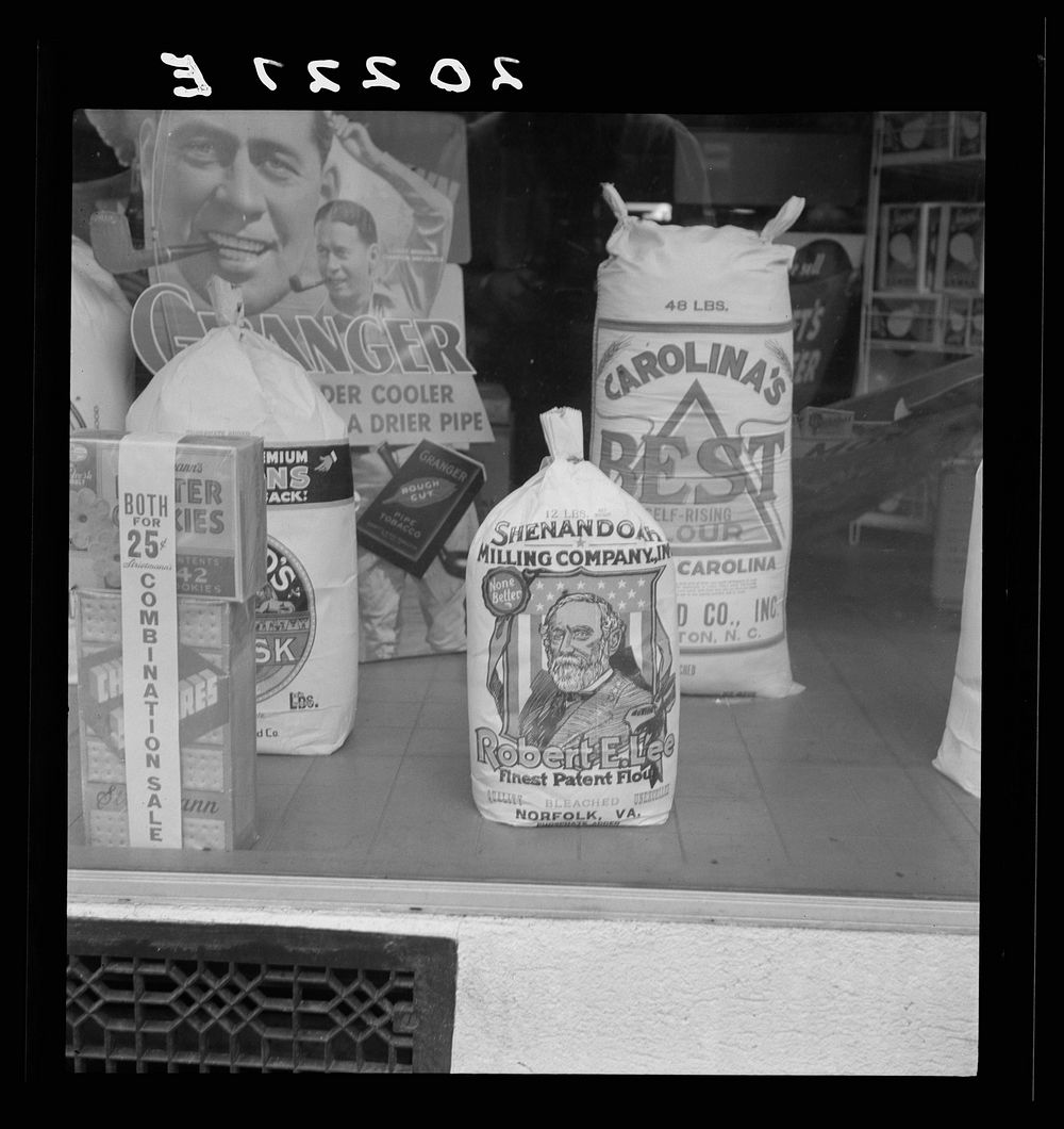 Grocery store window. Mebane, North Carolina. Sourced from the Library of Congress.