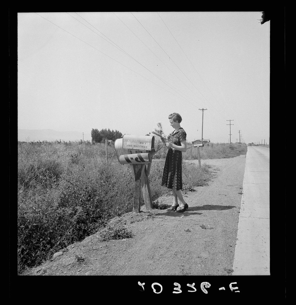 Mrs. Bouchey gets the morning mail. Wife of tenant purchase client. Washington, Yakima Valley, near Toppenish. Sourced from…