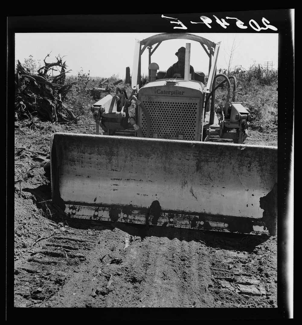 Western Washington, Lewis County, near Vader. Bulldozer equipped with grader type blade. Nieman farm.. Sourced from the…