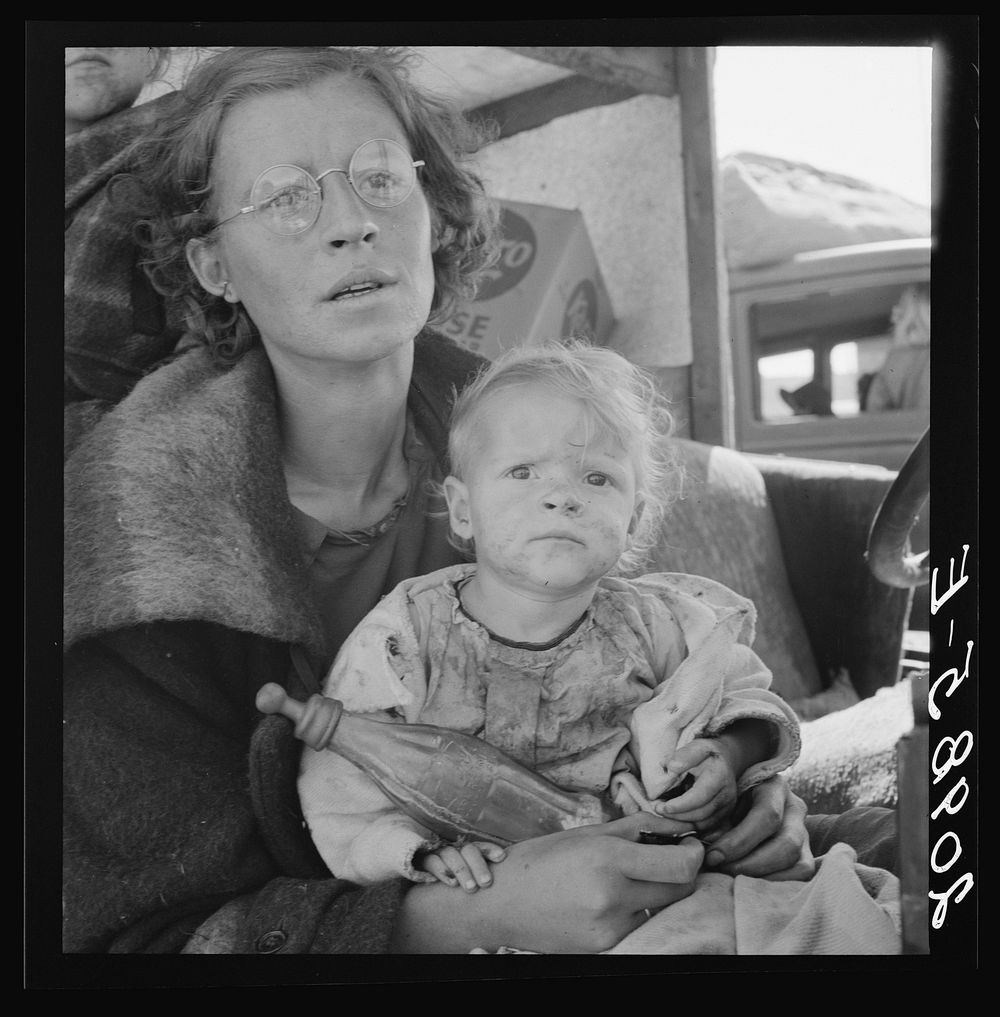 Mother and baby of family on the road. Tulelake, Siskiyou County, California. General caption number 65 by Dorothea Lange
