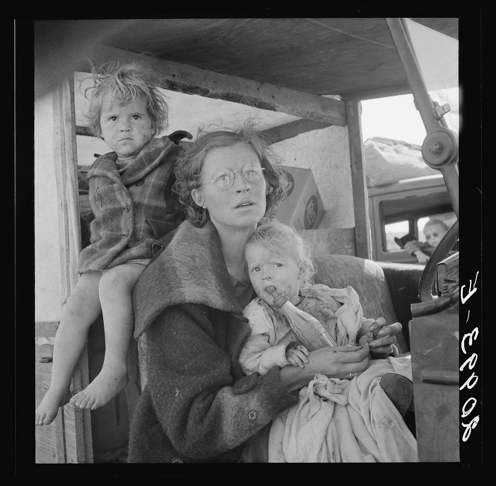 Mother and two children on the road. Tulelake, Siskiyou County, California. General caption number 65 by Dorothea Lange