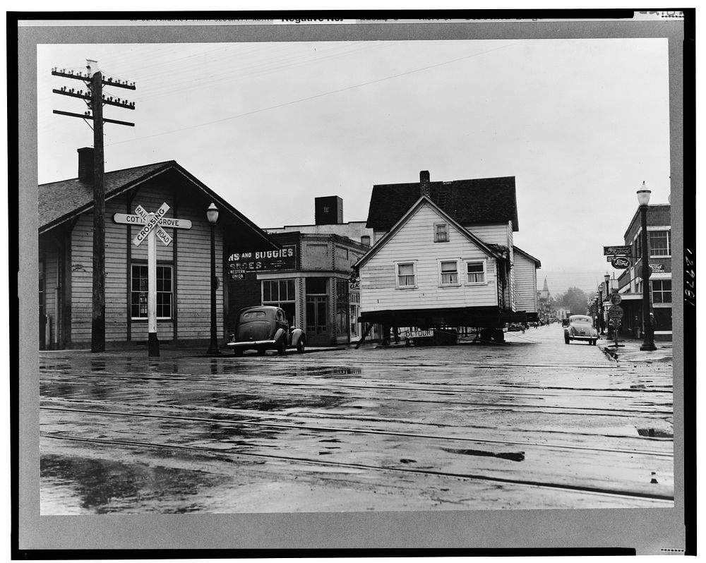 House being moved through the main street of town (population 2473). Deposited over Sunday on intersection of U.S. 99.…