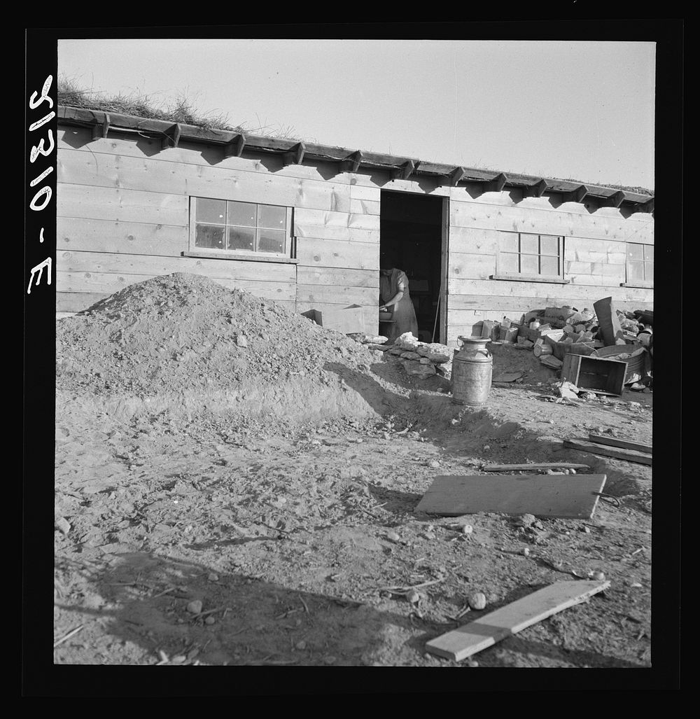 [Untitled photo, possibly related to: Mrs. Dougherty in doorway of basement house. Warm Springs, Malheur County, Oregon].…