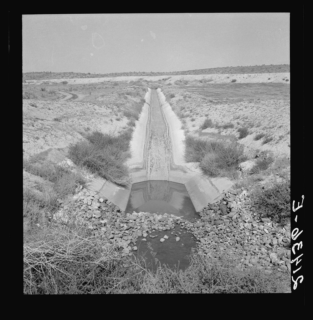Irrigation canal. Shows drop to go under road. Water has just been shut off for the season. Near Nyssa, Malheur County…
