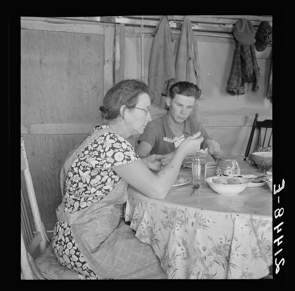 [Untitled photo, possibly related to: Mrs. Dazey and sixteen year old at lunch. The other children are working in neighbor's…