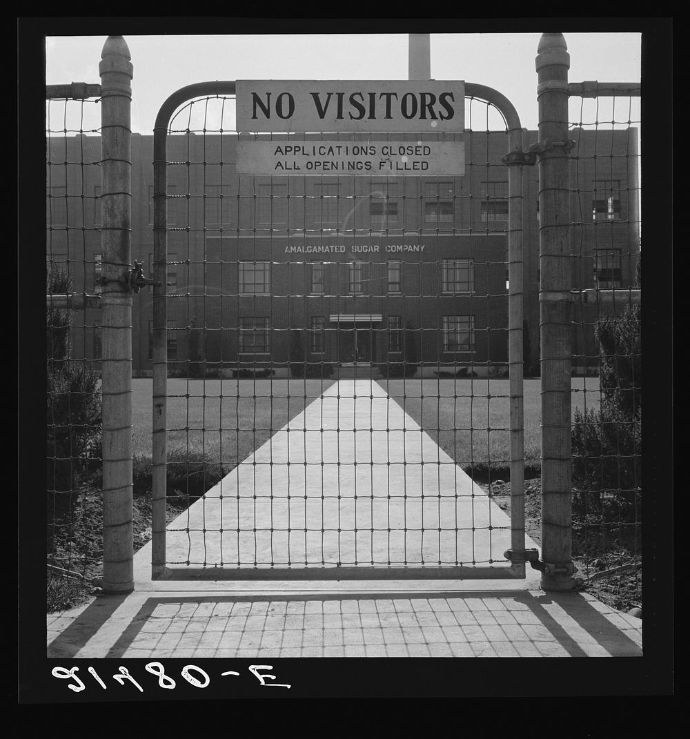 Entrance to Amalgamated Sugar Company factory at opening of second beet season. Nyssa, Oregon. Sourced from the Library of…