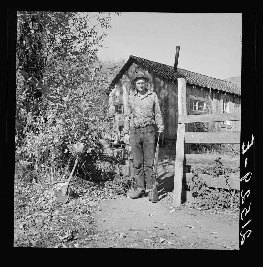 [Untitled photo, possibly related to: Roy Carlock, member of Ola self-help sawmill co-op, in front of his new house. He is…
