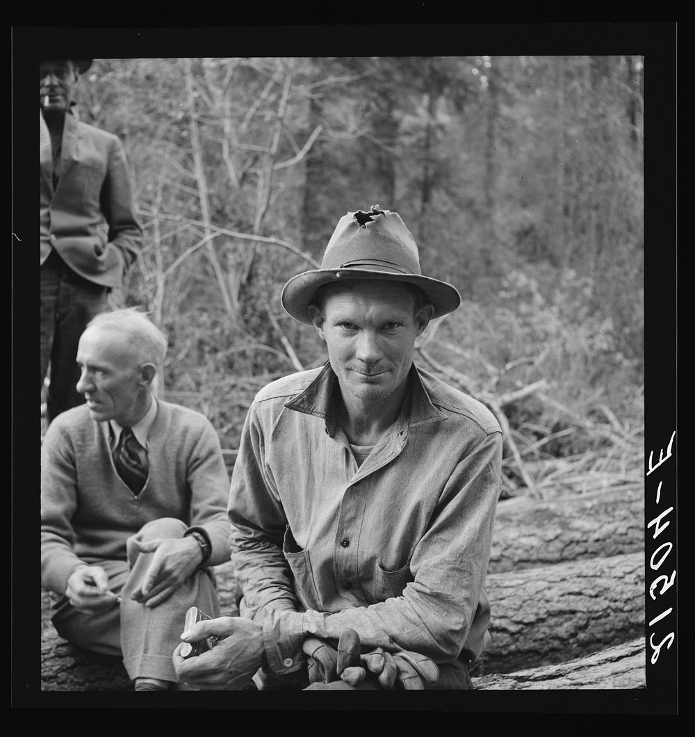 Member of the co-op in the woods. Ola self help cooperative sawmill. Gem County, Idaho. See general caption 48. Sourced from…