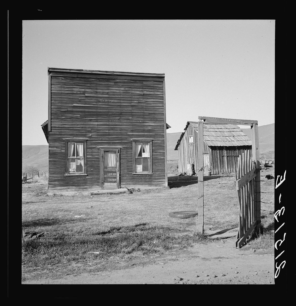 [Untitled photo, possibly related to: Farmer saloon and stagecoach tavern which is the temporary home of a member of the Ola…