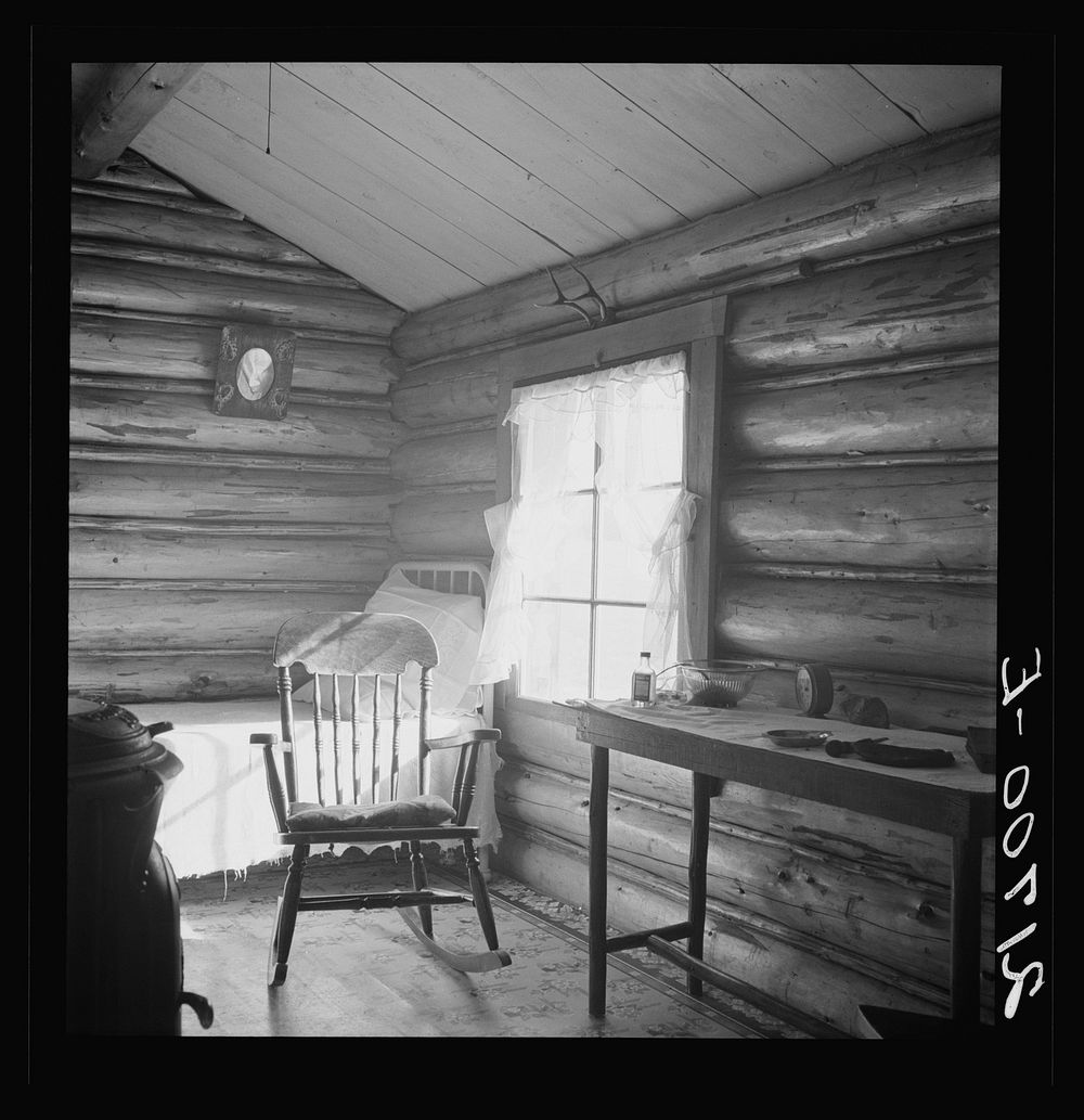 [Untitled photo, possibly related to: Interior of farmer's two-room log home. FSA (Farm Security Administration) borrower.…