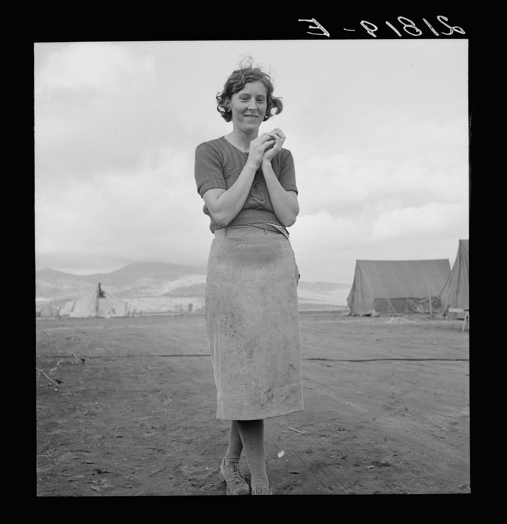 Young migrant mother has just finished washing. Merrill FSA (Farm Security Administration) camp, Klamath County, Oregon. See…