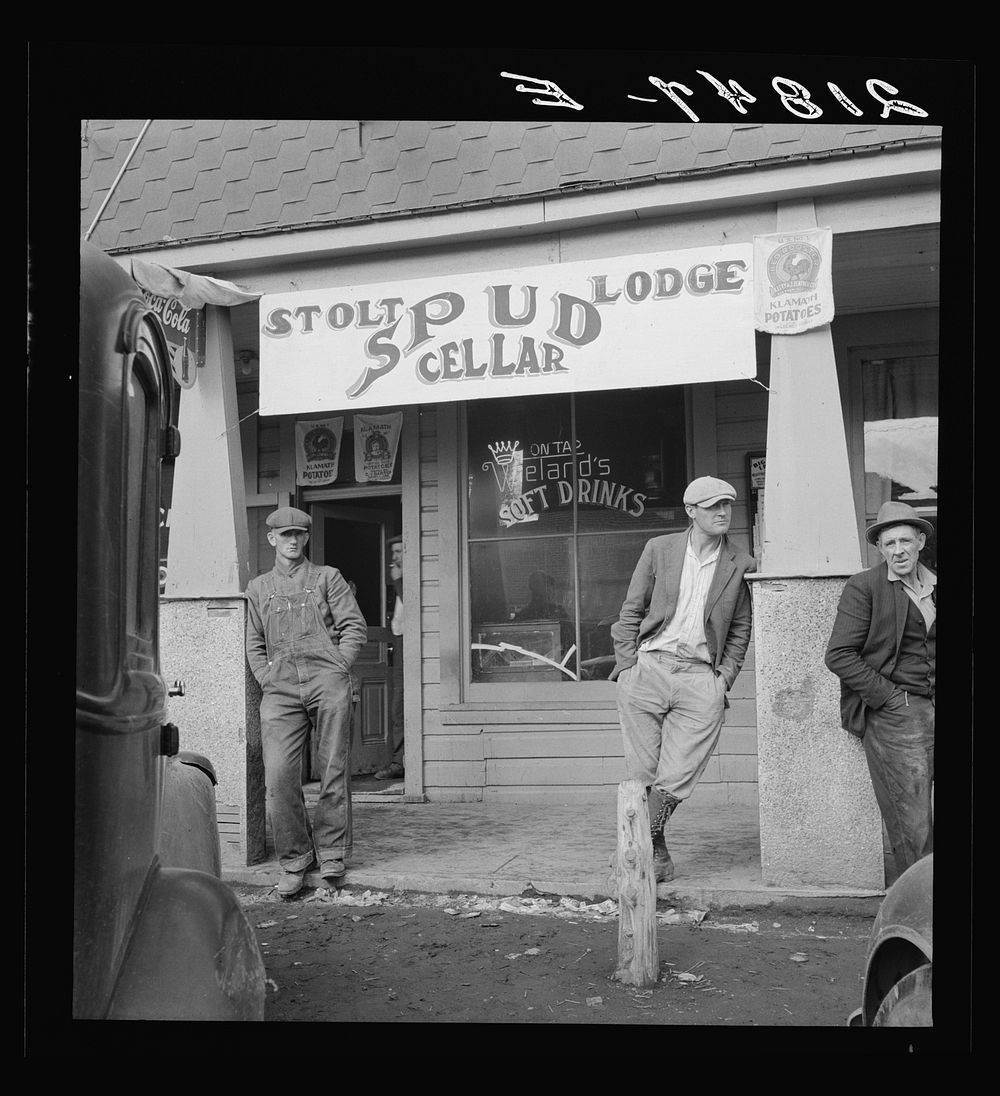 On main street of potato town during harvest season. Merrill, Oregon. Sourced from the Library of Congress.