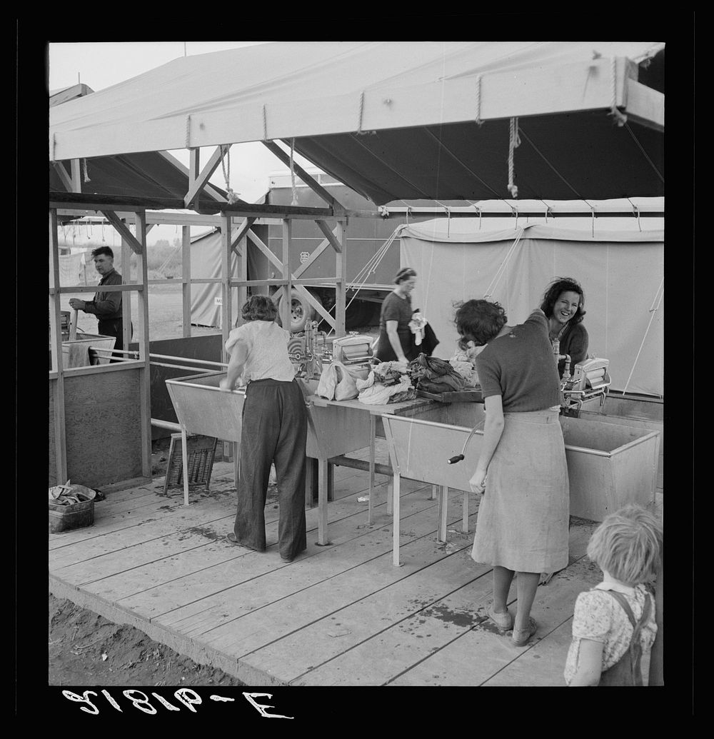 Portable laundry unit, shower unit beyond. FSA (Farm Security Administration) camp, Merrill, Oregon. See general caption 62.…