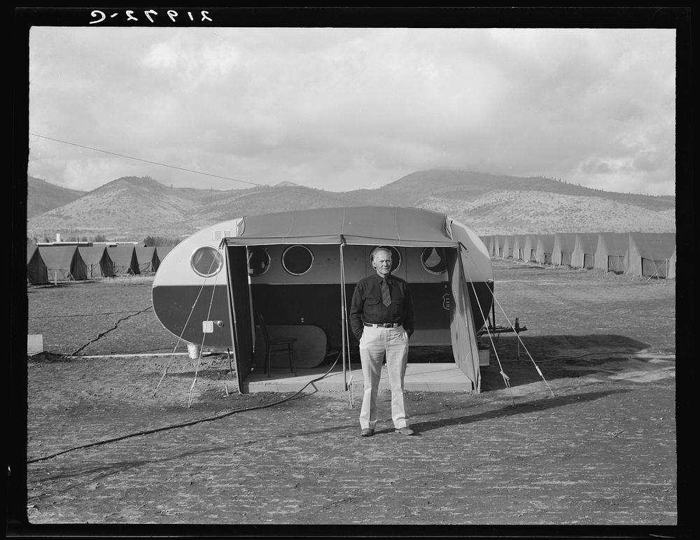 [Untitled photo, possibly related to: The camp manager, the office trailer and view of mobile camp (FSA - Farm Security…