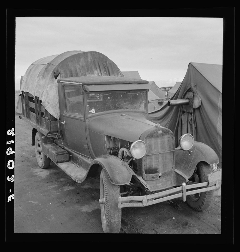 Truck, baby parked on front seat. Merrill, Klamath County, Oregon, in FSA (Farm Security Administration) camp. Sourced from…