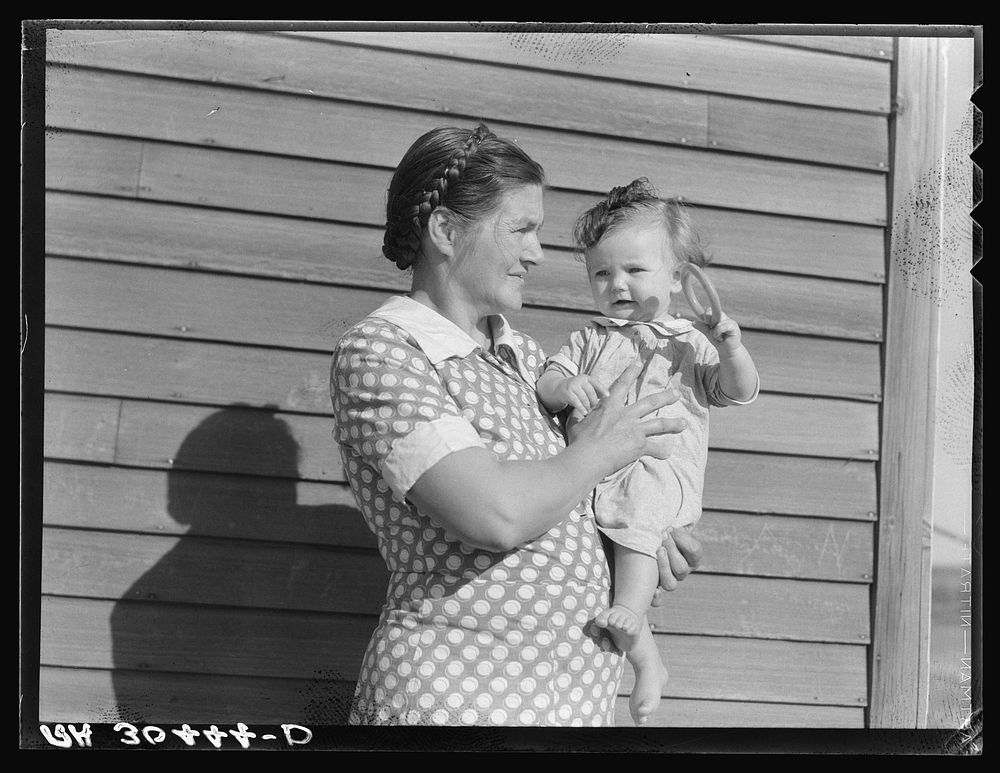 Mother and child on farm. Williams County, North Dakota by Russell Lee