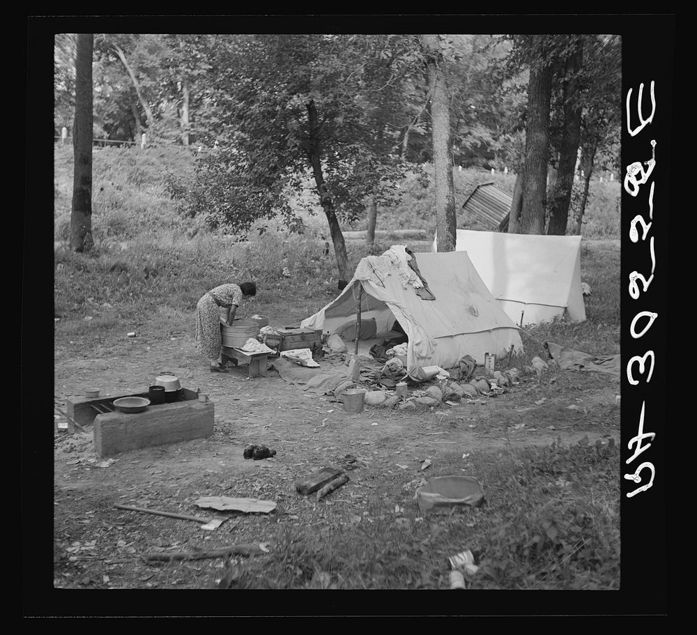 Indian woman washing clothes. Blueberry camp, Littlefork, Minnesota by Russell Lee