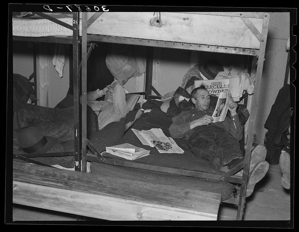 Lumberjacks resting in bunkhouse at logging camp near Effie, Minnesota by Russell Lee