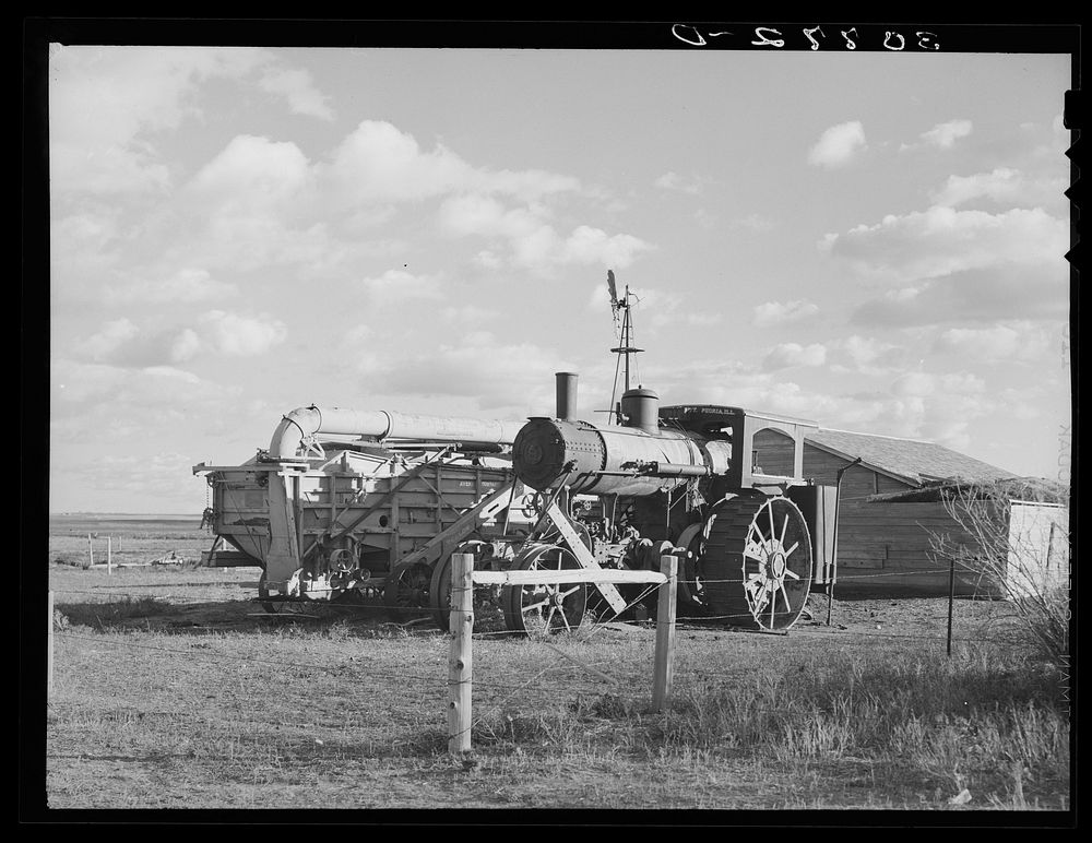 Old steam tractor and threshing machine, idle for nine years. Ellisville Township, Williams County, North Dakota by Russell…
