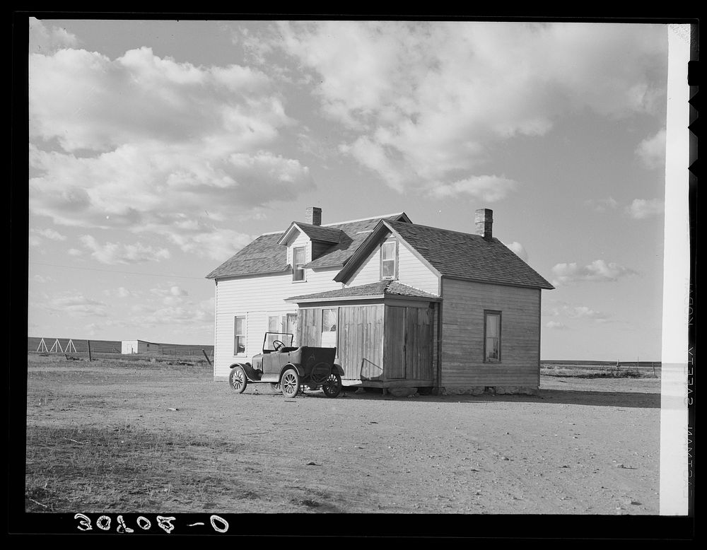 Farmhouse and old car. Williams County, North Dakota by Russell Lee