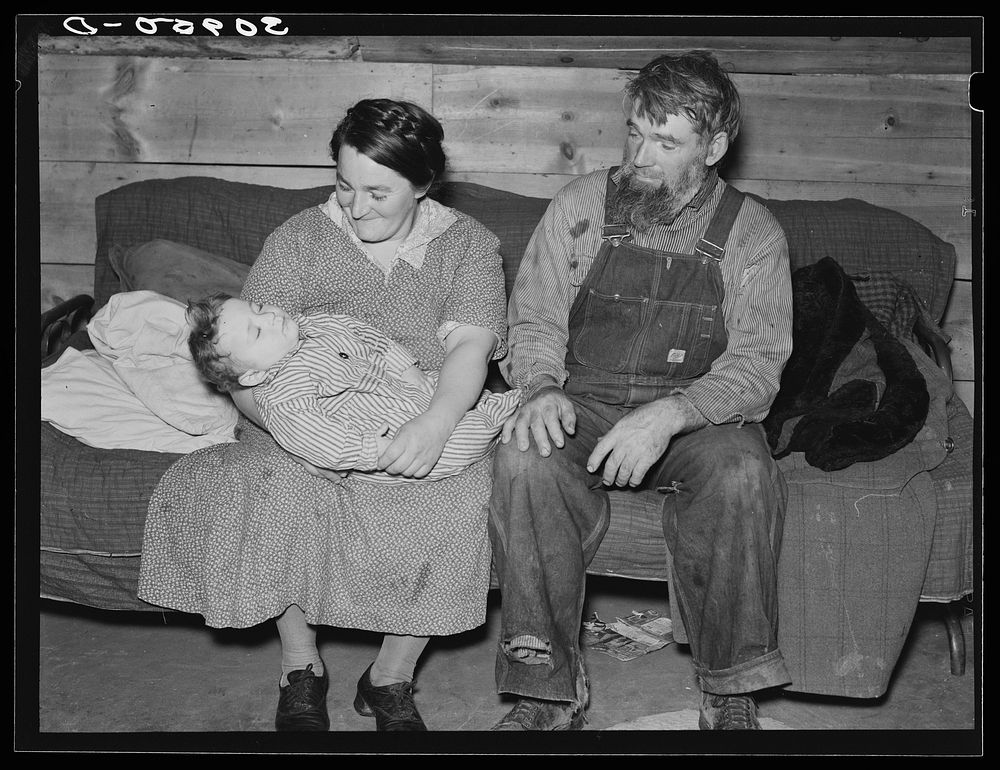 Mr. and Mrs. Harshenberger [i.e. Harshbarger] and baby. Mennonite farmers near Antelope, Montana by Russell Lee