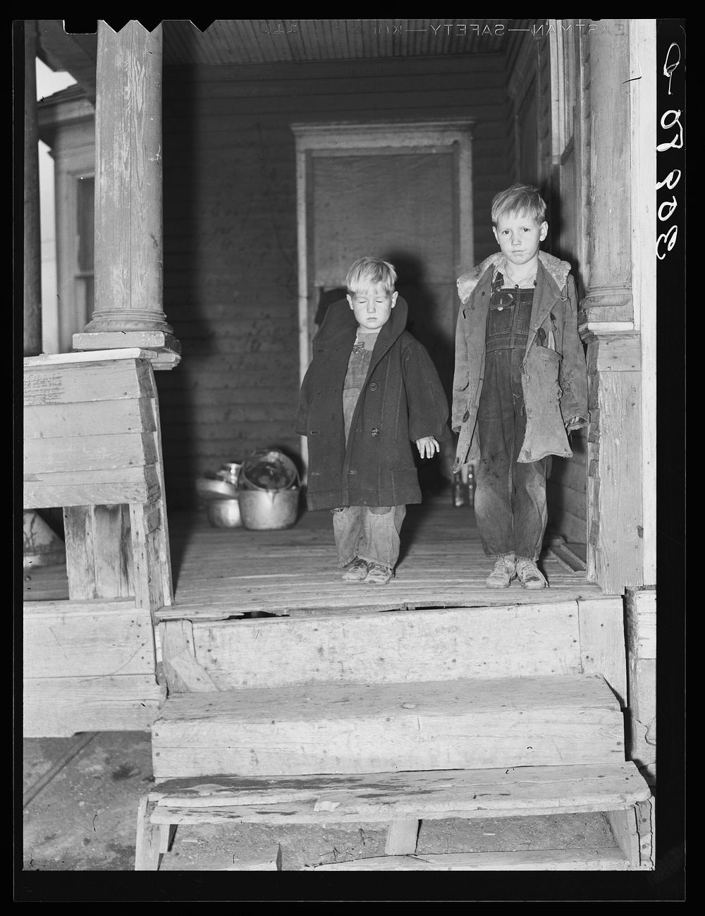 Two children of Carl Thorson on porch of home. Crosby, North Dakota by Russell Lee