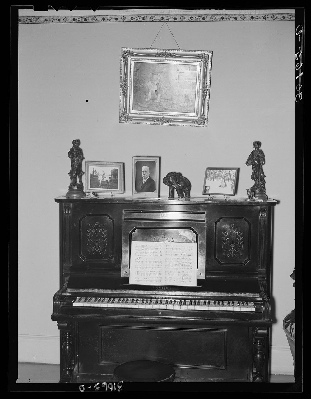 Piano and decoration in house. Two Bit Creek, near Deadwood, South Dakota by Russell Lee