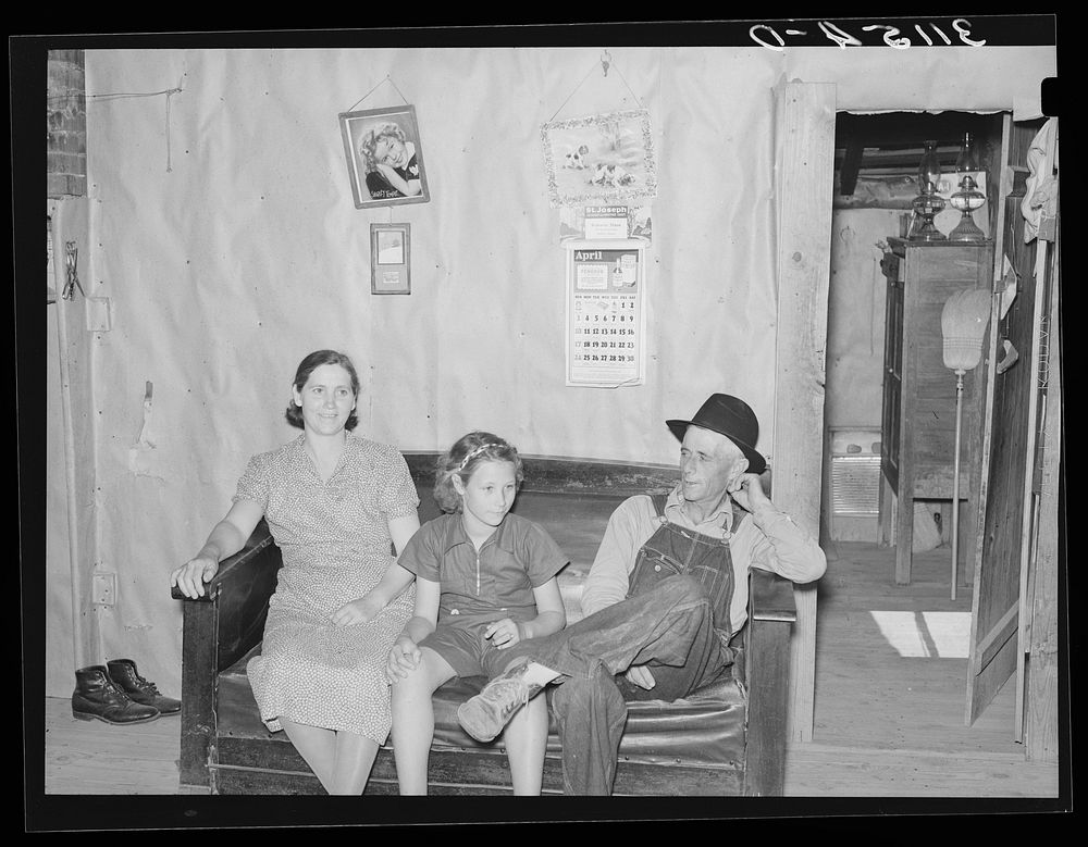 Southeast Missouri Farms. Sharecropper's family in shack home. La Forge project, Missouri by Russell Lee