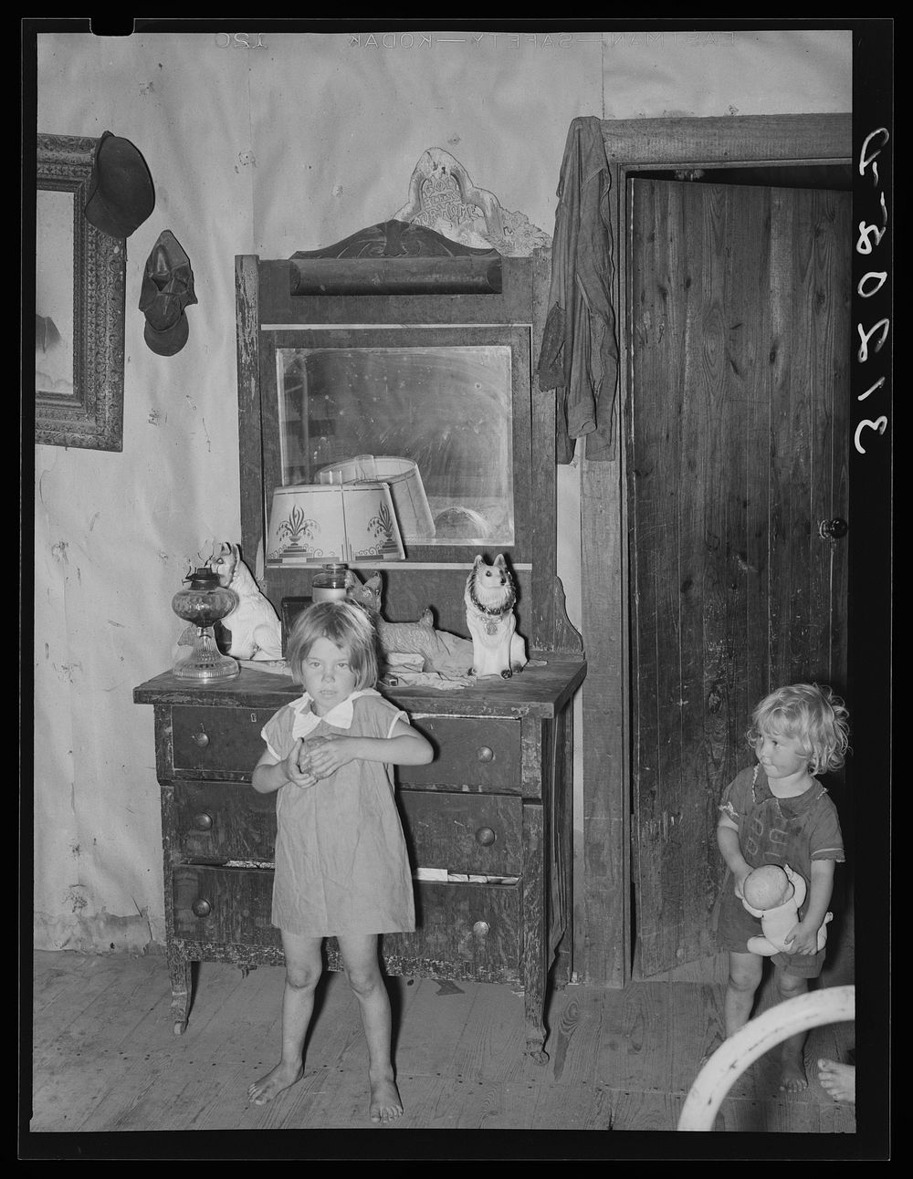 Southeast Missouri Farms. Children of FSA (Farm Security Administration) client, former sharecropper, in bedroom of shack…
