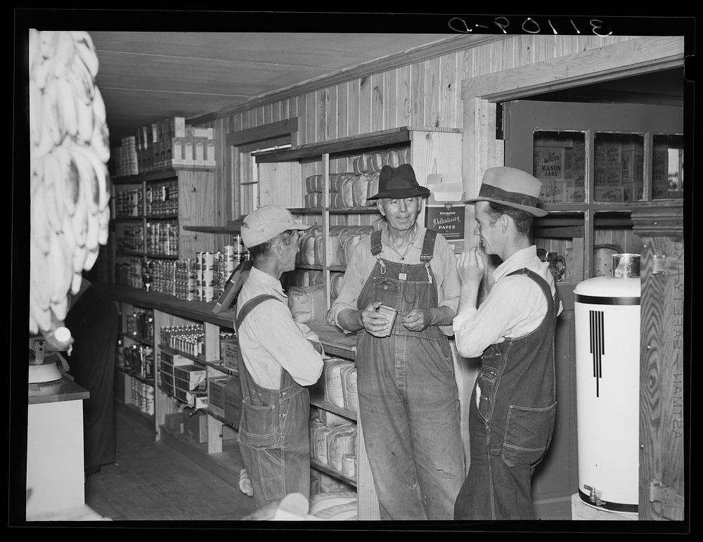 Southeast Missouri Farms. Farmers talking together in cooperative store. La Forge project, Missouri by Russell Lee