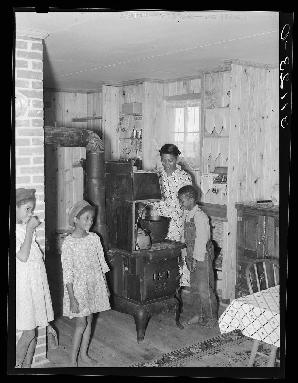 Southeast Missouri Farms. Sharecropper family in new home. La Forge project, Missouri by Russell Lee