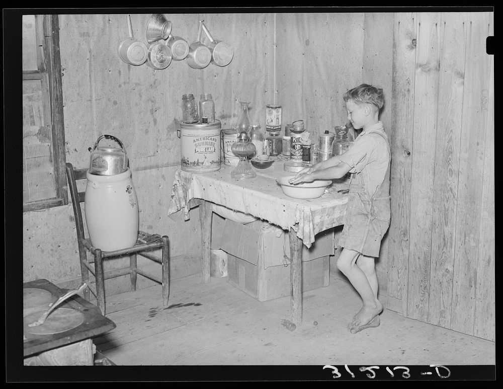 Southeast Missouri Farms. Son of sharecropper washing hands by Russell Lee