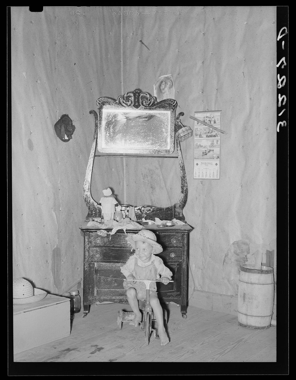 Southeast Missouri Farms. Son of sharecropper in bedroom of shack home by Russell Lee