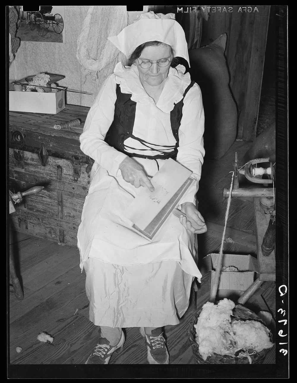 Madame Dronet carding cotton. Erath, Louisiana by Russell Lee