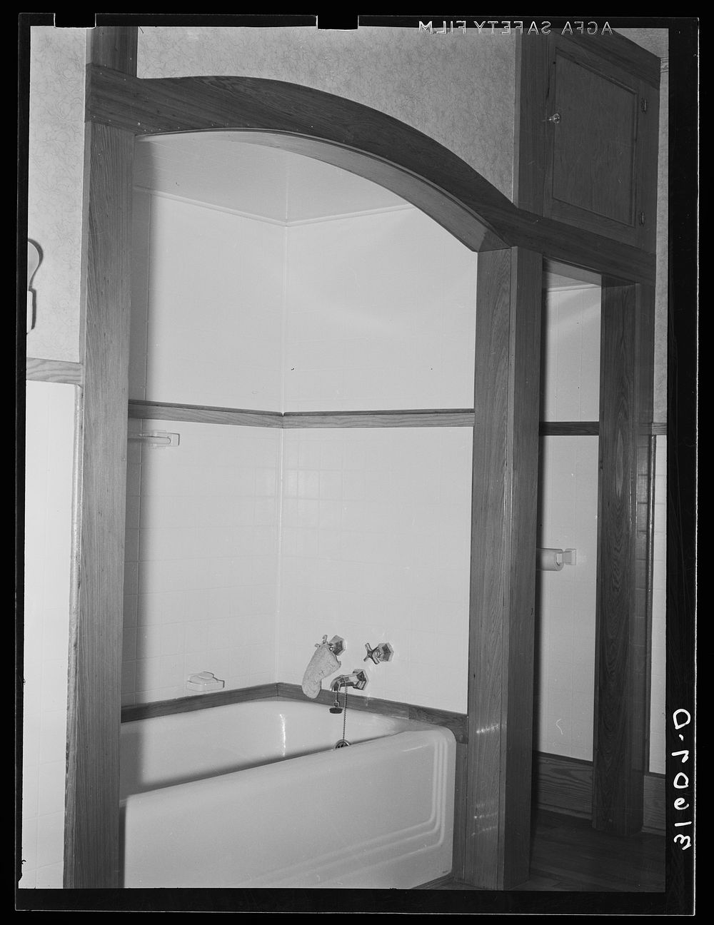 Recessed bathtub in home of Joseph La Blanc. Crowley, Louisiana by Russell Lee