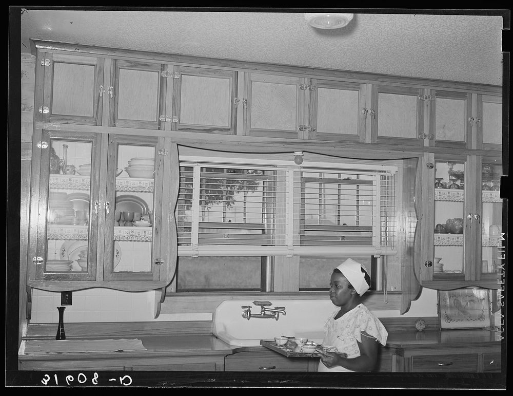 Kitchen of Joseph La Blanc near Crowley, Louisiana, with  maid by Russell Lee