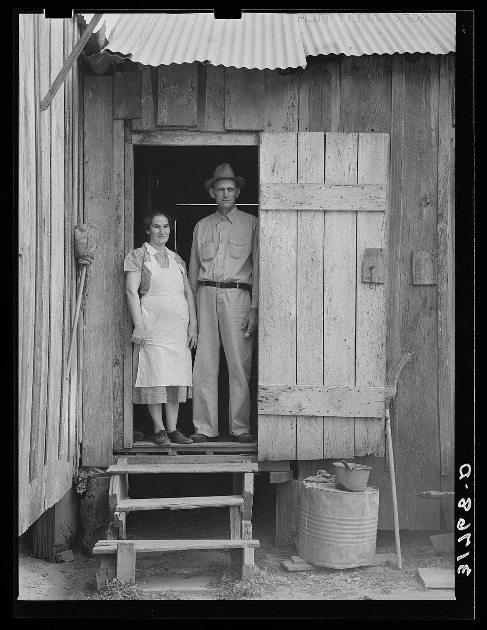 Mr. and Mrs. Emil Kimball standing in doorway of farm home. They will participate in tenant purchase program. Morganza…