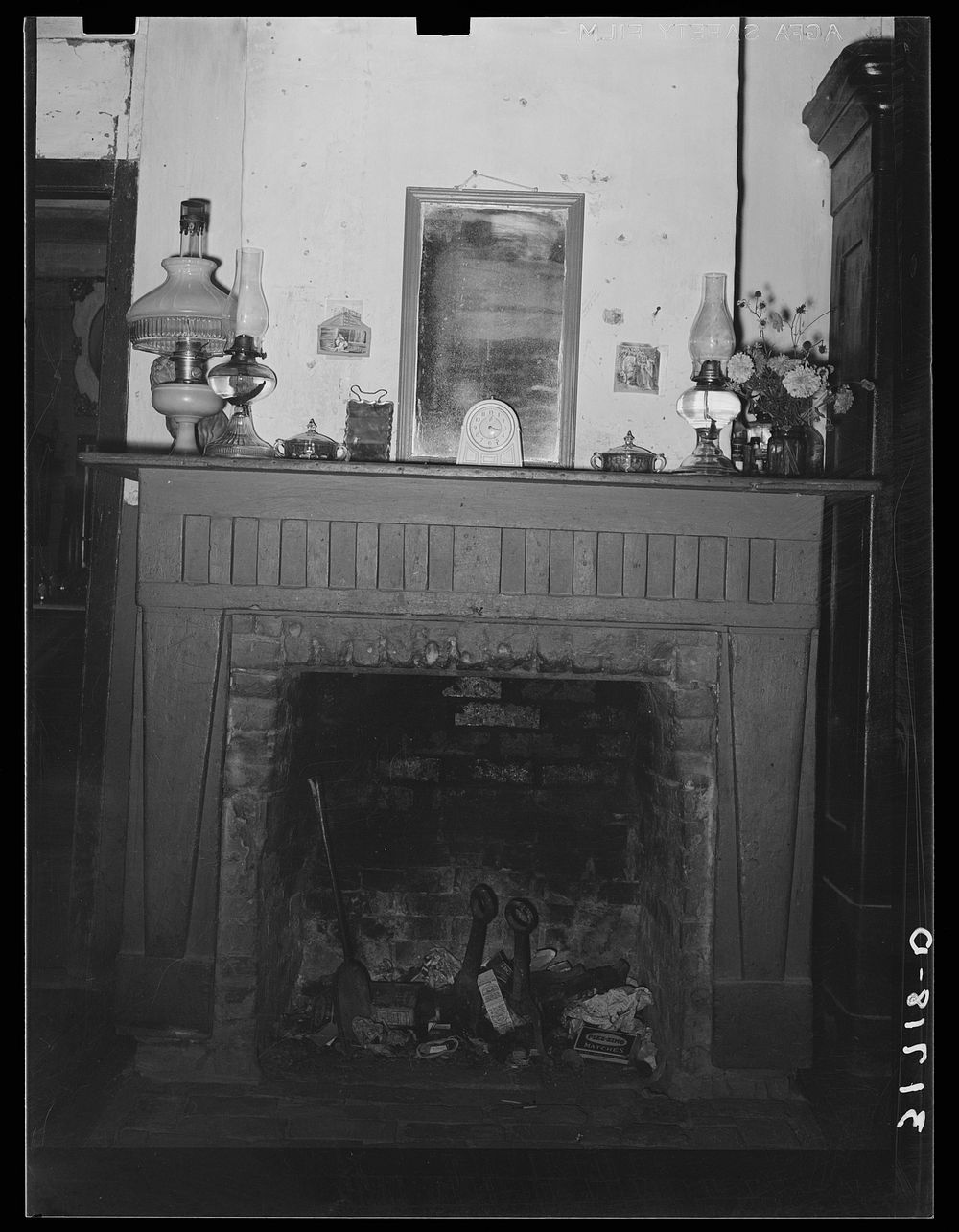 Fireplace in Acadian home near Breaux Bridge, Louisiana by Russell Lee