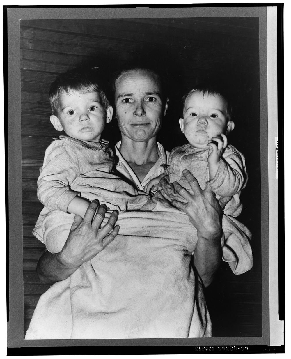 Mrs. Scarbrough with two youngest children. Laurel, Mississippi by Russell Lee