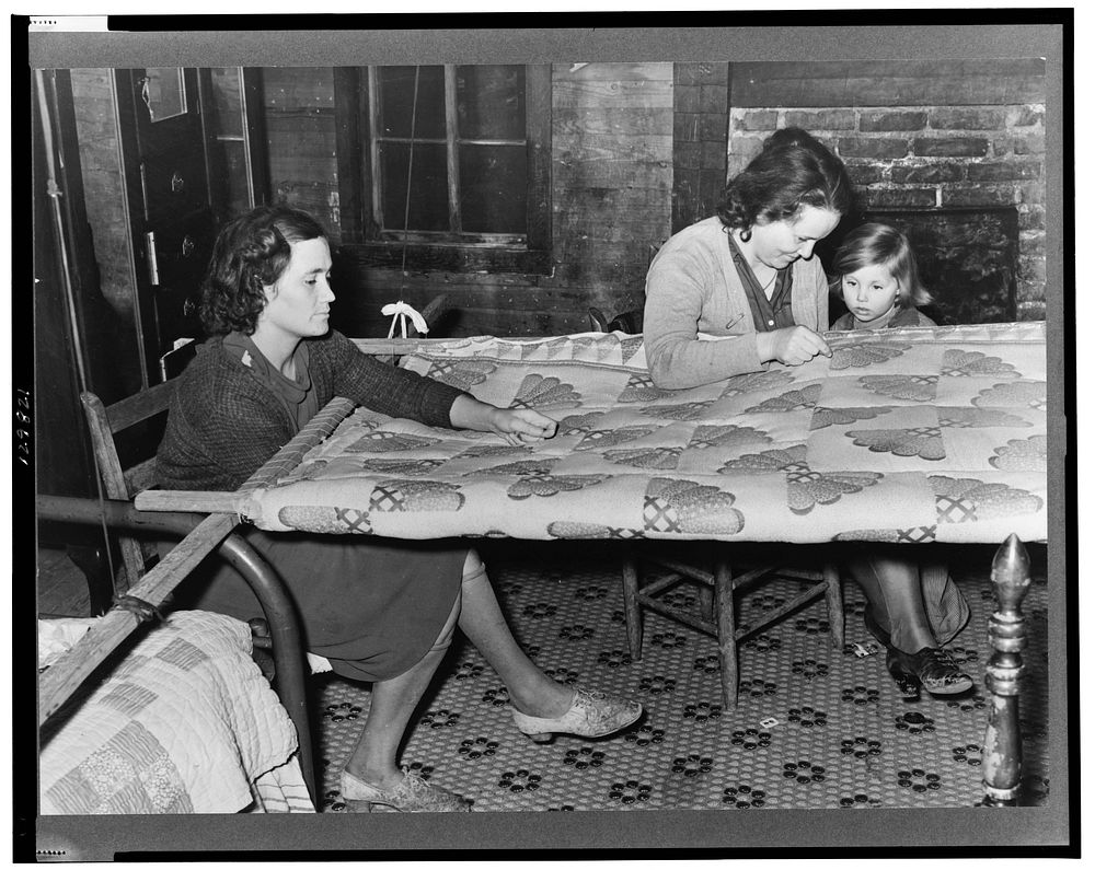 Quilting in sharecropper's home near Pace, Mississippi. Background photo for Sunflower Plantation by Russell Lee